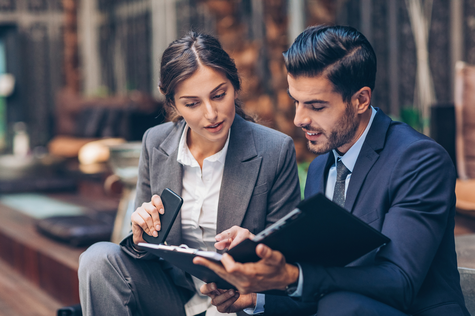 Business persons discussing documents
