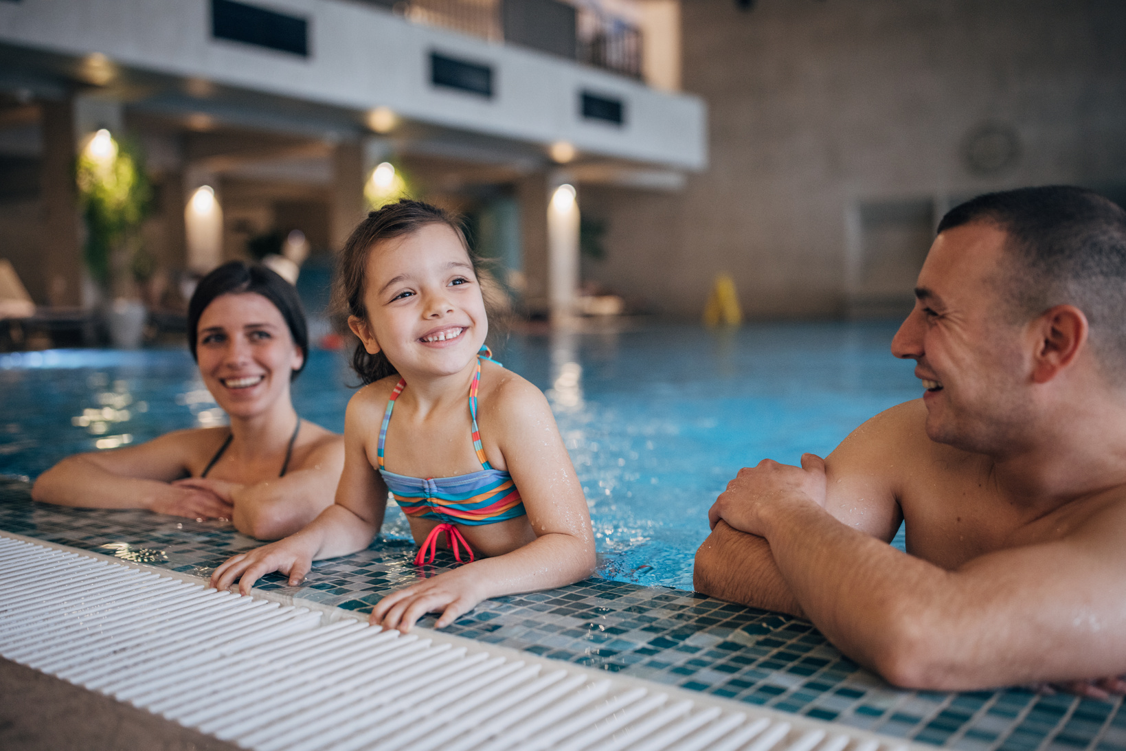 Family in hotel pool